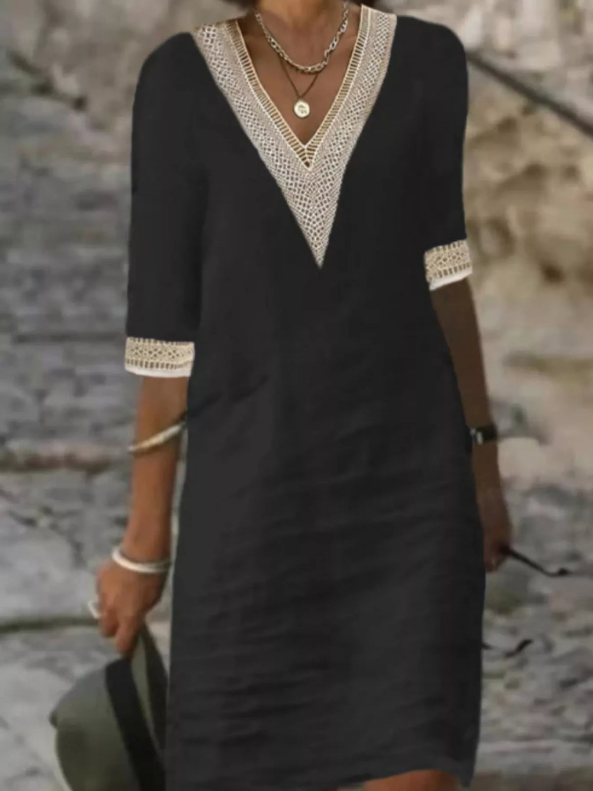 Black V-neck lace-trim half-sleeve dress with lace cuffs and relaxed shift silhouette