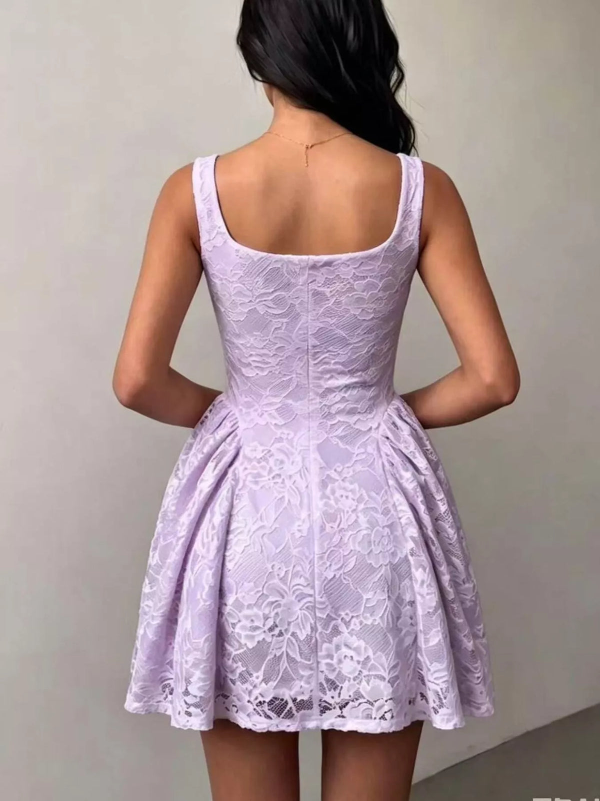 Lavender lace sleeveless dress with open back and floral textured overlay