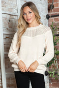 Cream rib-knit sweater with round neckline, long sleeves, and textured yoke stripe detail