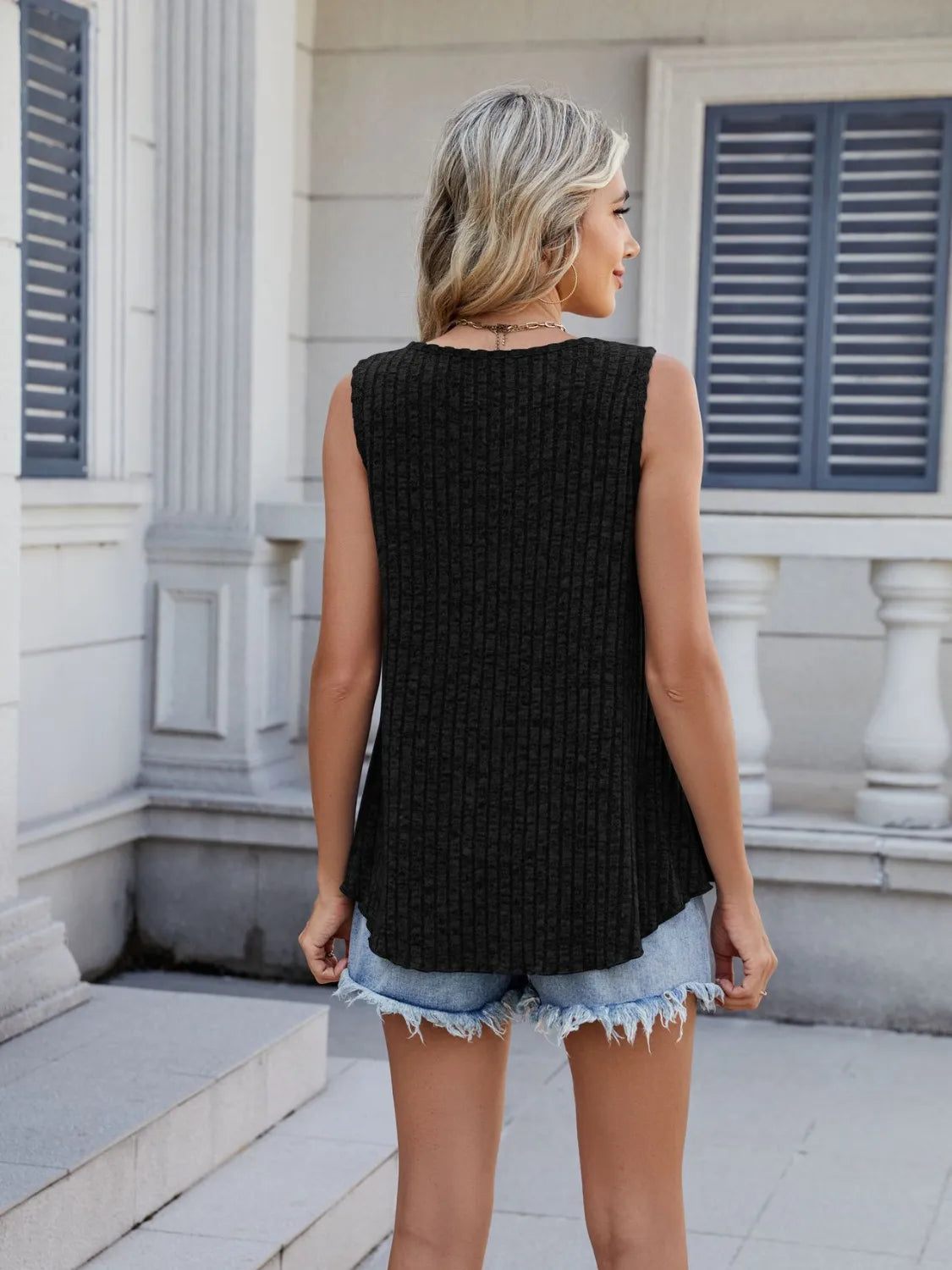 Black ribbed round-neck tank, sleeveless back with curved hem