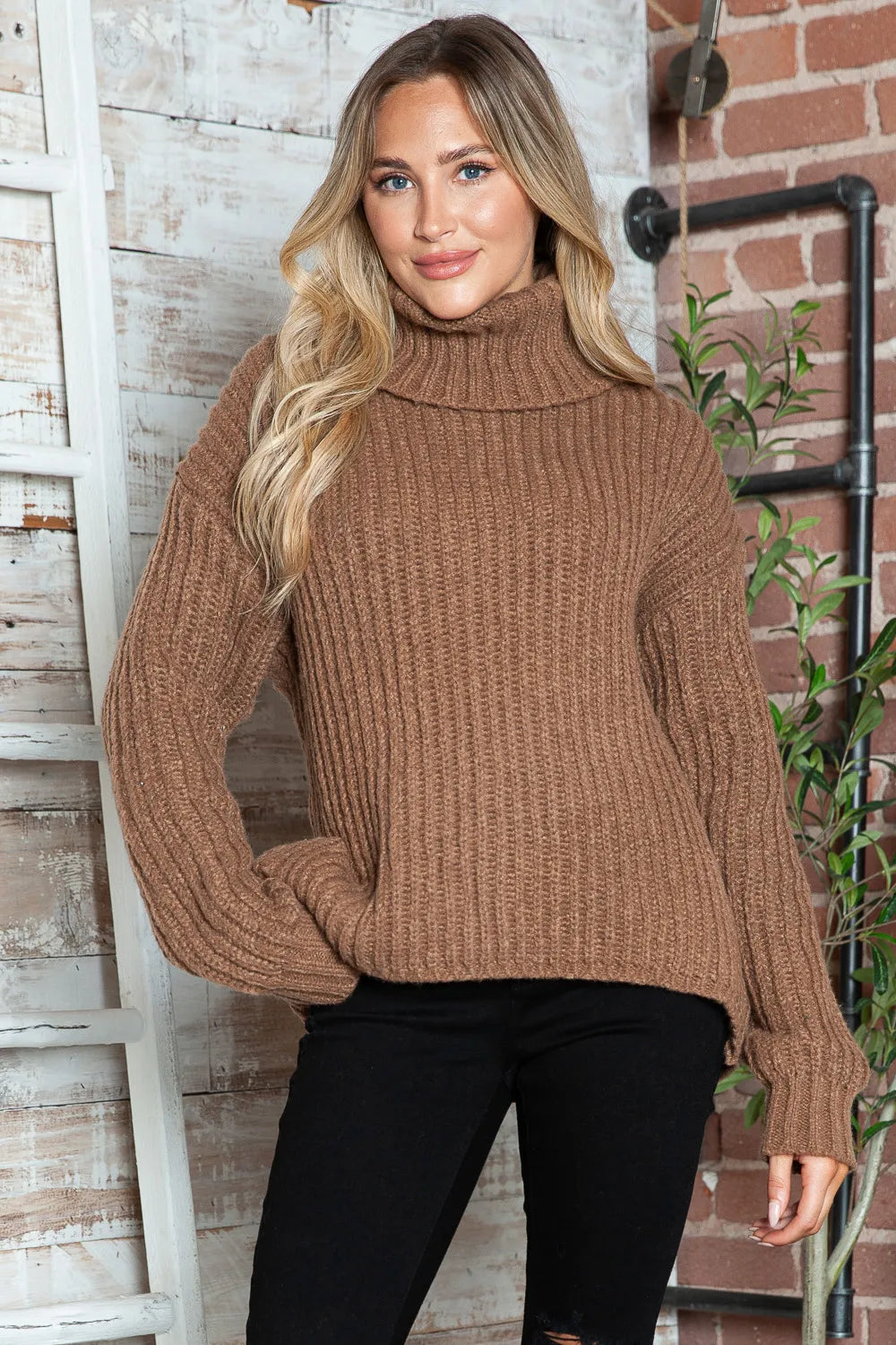 Brown ribbed turtleneck pullover sweater with dropped shoulders and long sleeves