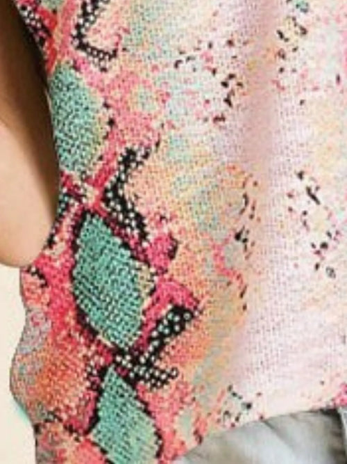 Close-up of snakeskin print camisole tank in pink, teal, and black