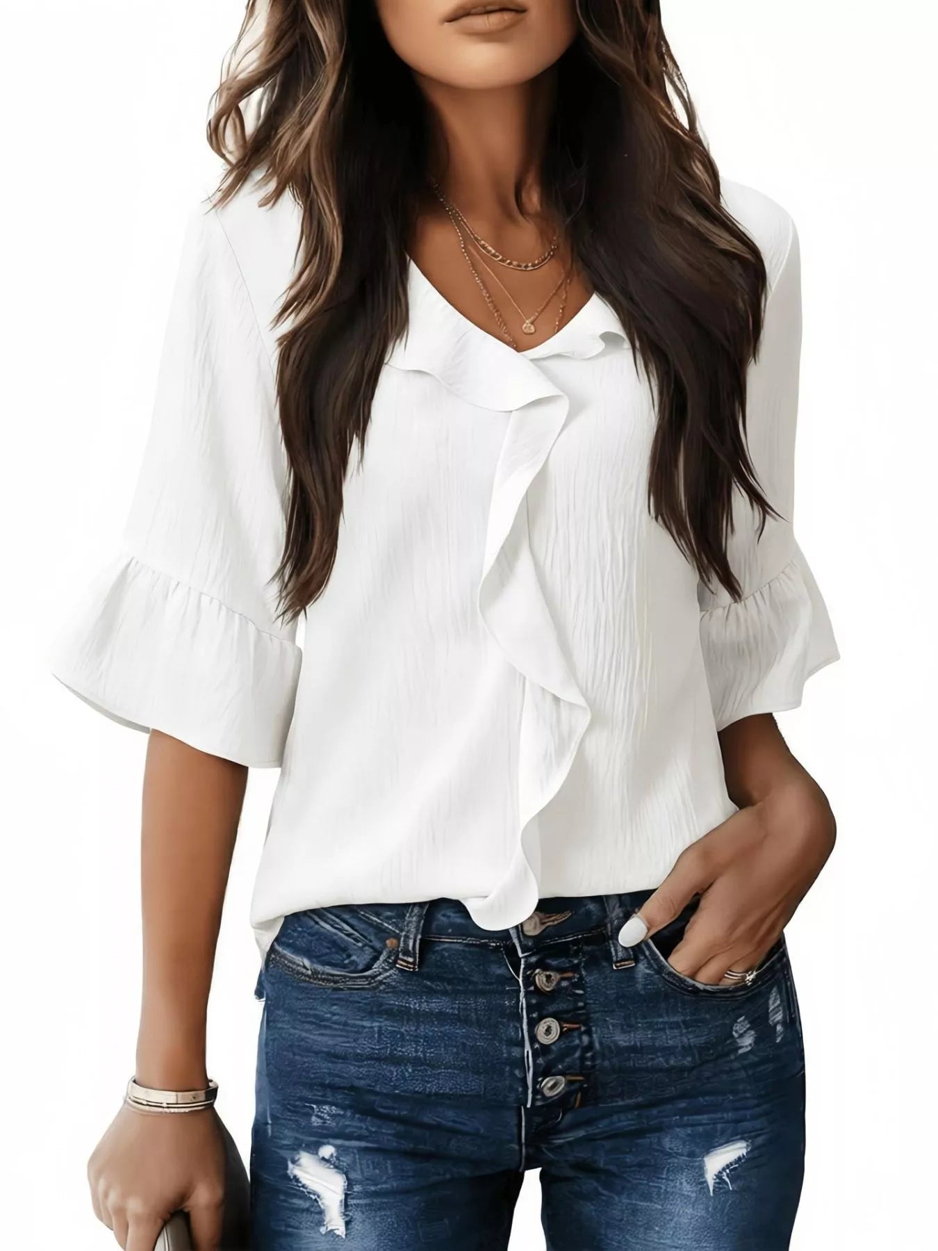 White ruffle-trim V-neck blouse with layered ruffle front and flared sleeves.
