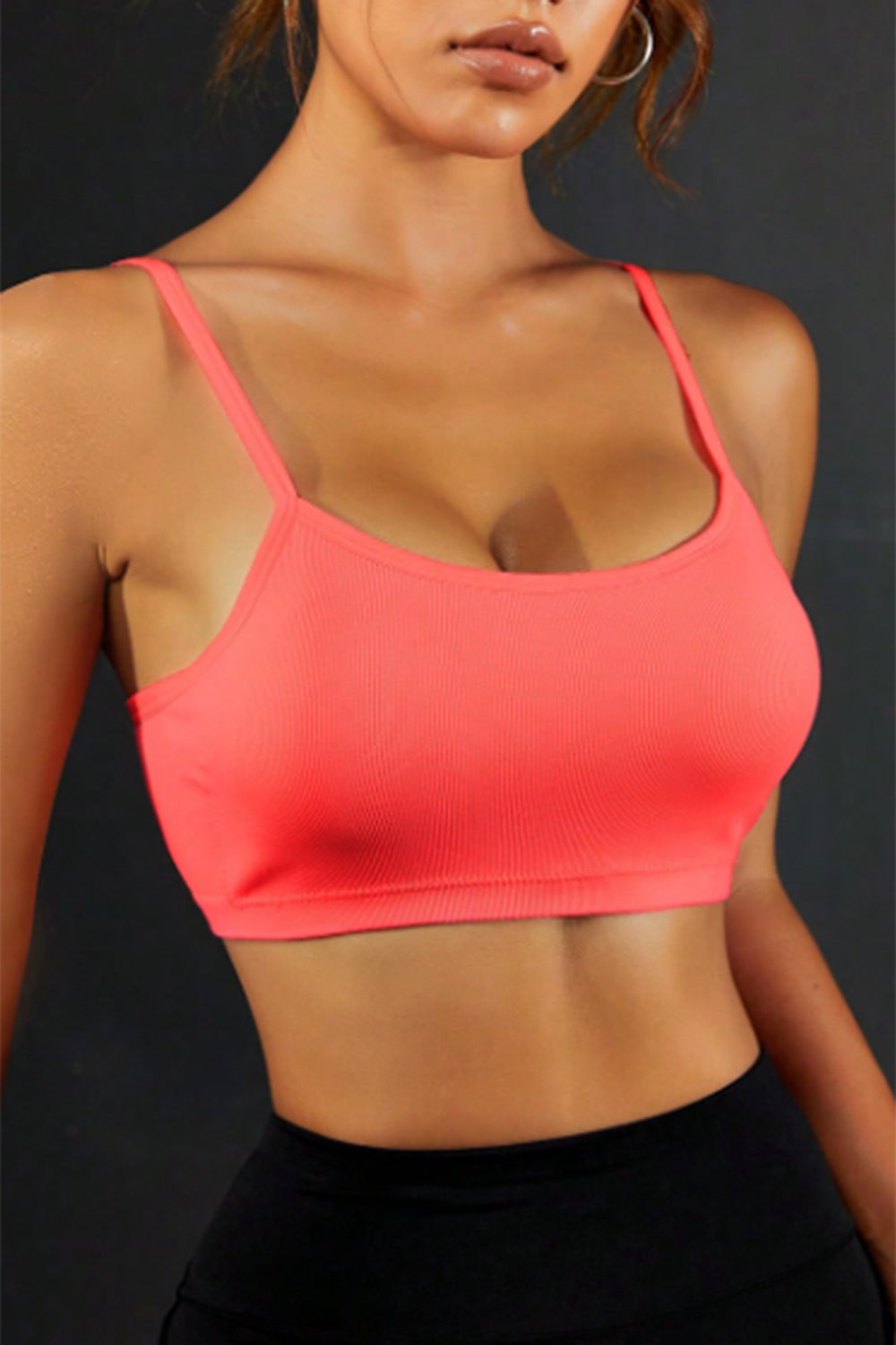 Coral backless sports cami with scoop front and thin straps.