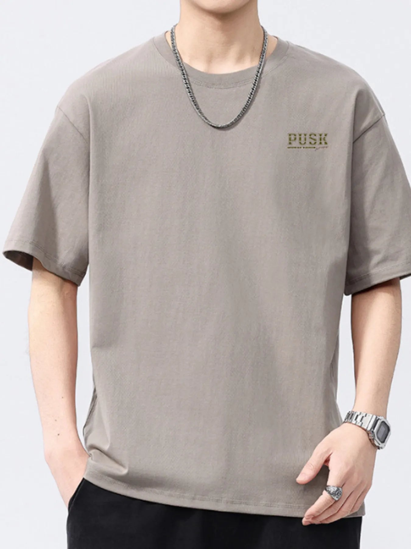 Khaki men's short-sleeve crewneck T-shirt with small chest logo.