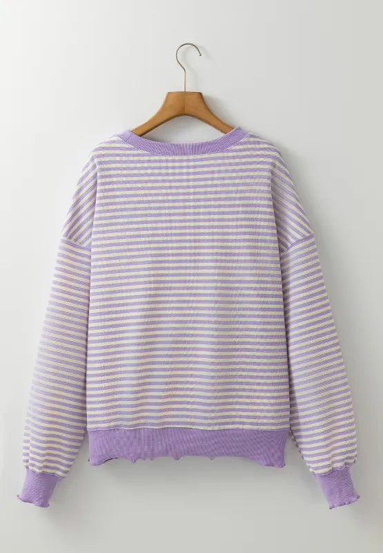 Lavender and white striped sweatshirt on hanger, long sleeves and ribbed hem