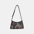 Geometric printed crossbody bag, black base with colorful pattern and top zip