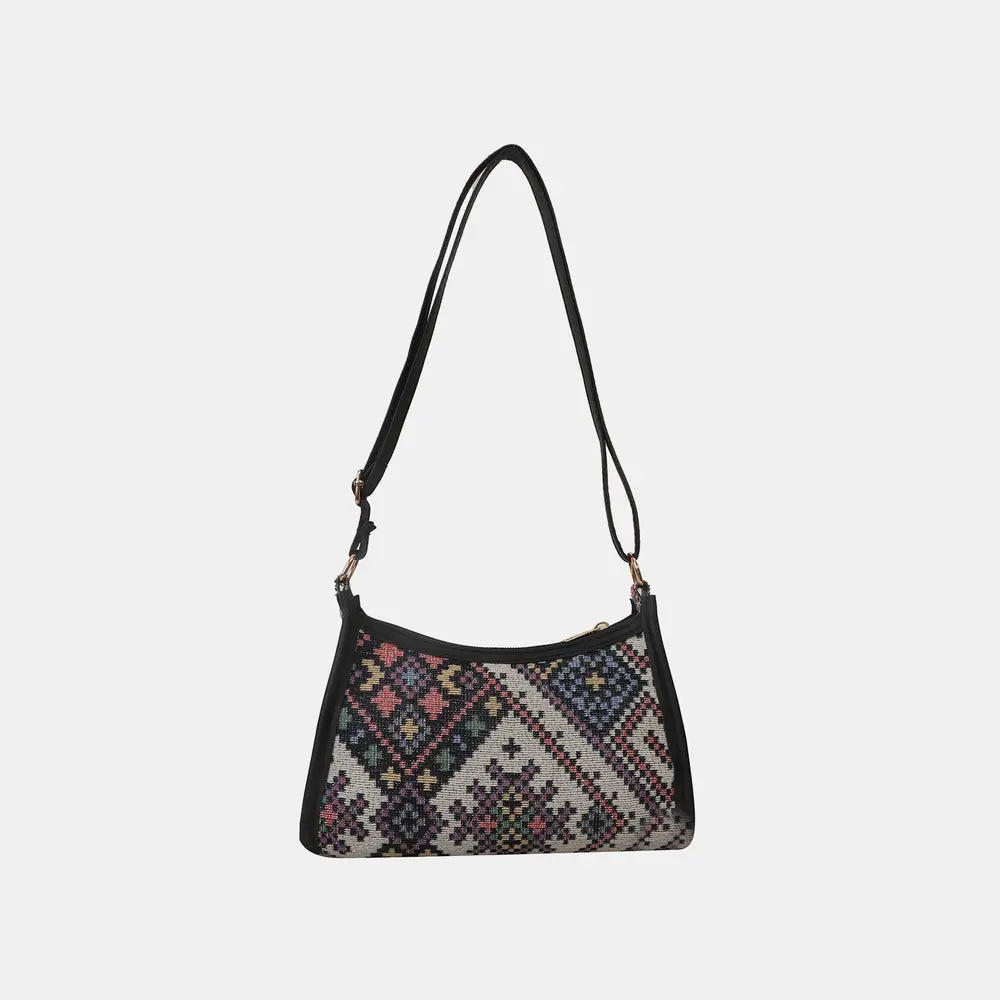 Geometric printed crossbody bag, black base with colorful pattern and top zip