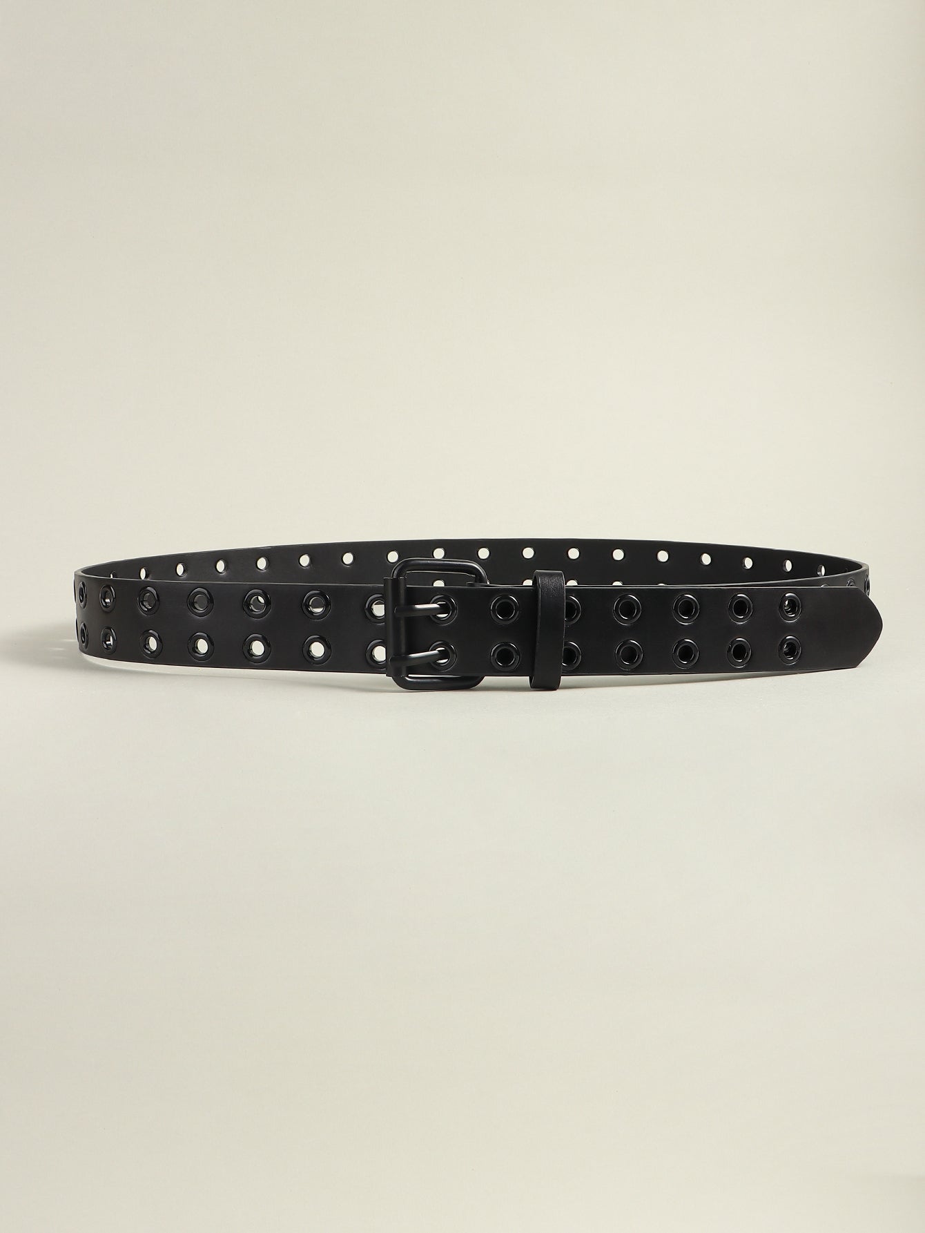 Vegan leather grommet belt in black with square buckle and metal eyelets