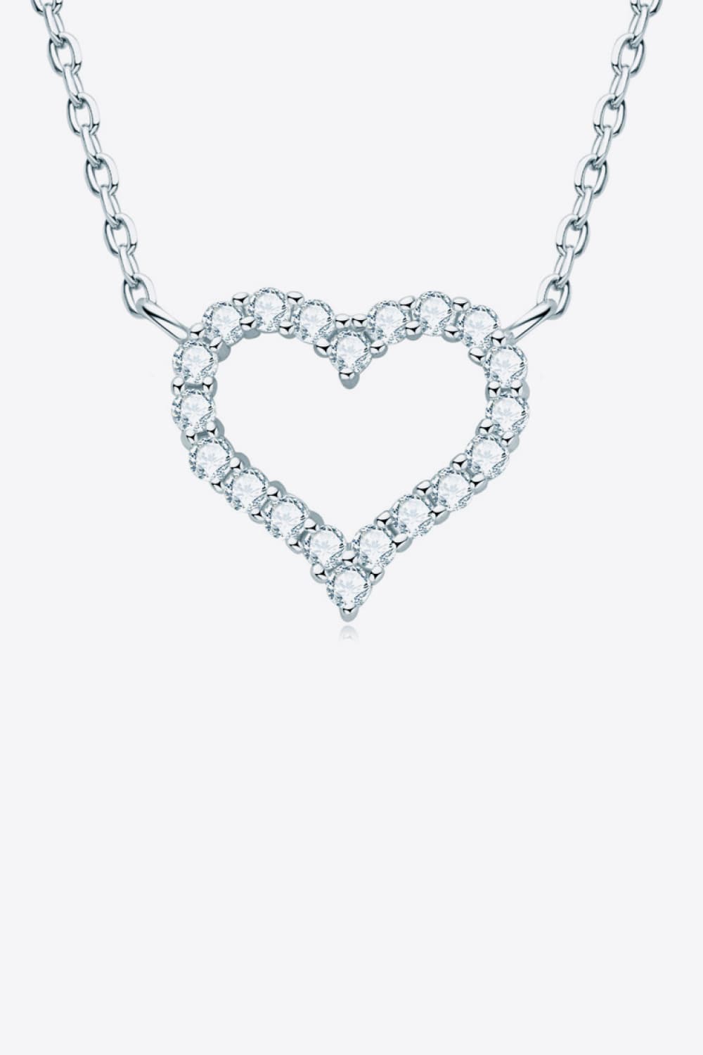 Heart-shaped pavé pendant necklace on a silver chain, studio view