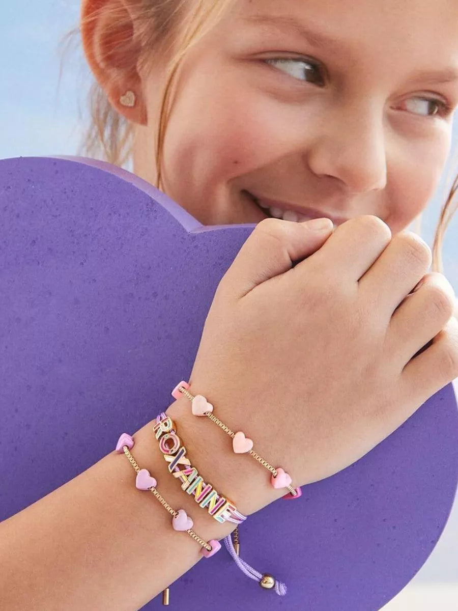 Pink heart charm adjustable bracelet with gold clasp and heart bead dangles