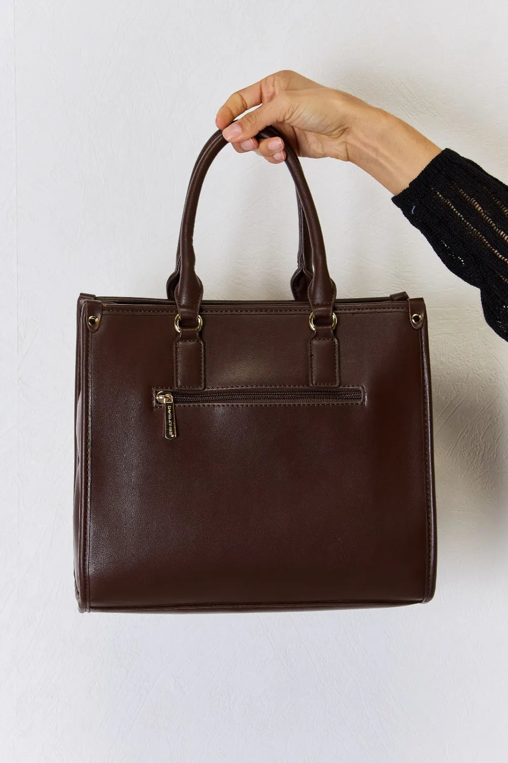 Chocolate-brown PU leather handbag with rectangular shape and front buckle strap