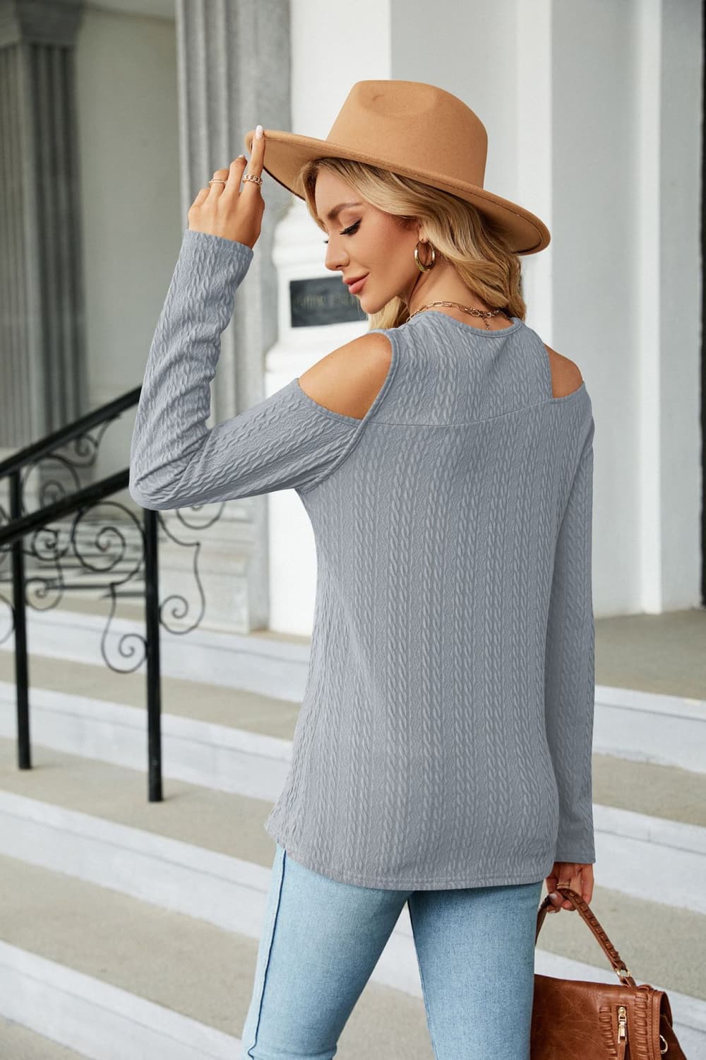 Light blue cold-shoulder long sleeve blouse with dropped shoulders, shown from the back