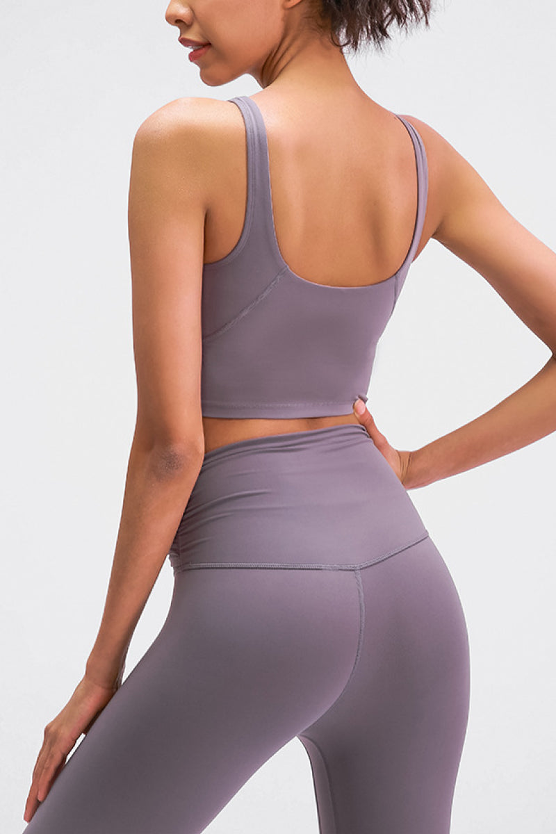 Mauve scoop-back sports bra viewed from the back with wide straps