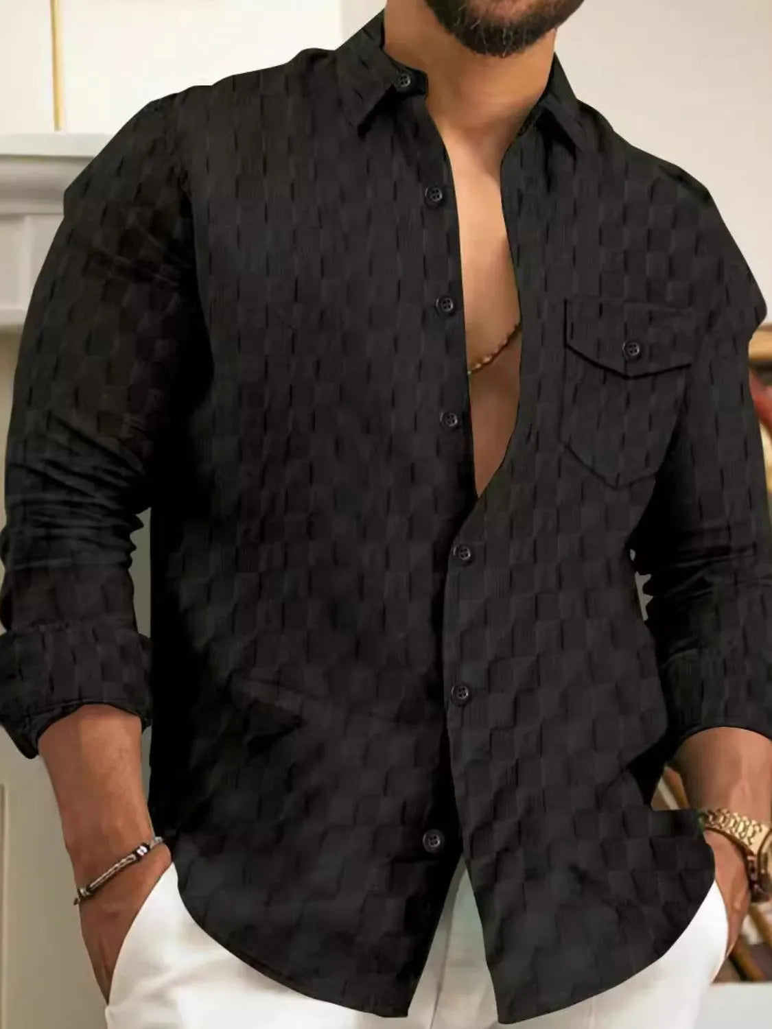Men's button-up long-sleeve shirt, textured black with chest pocket and button placket