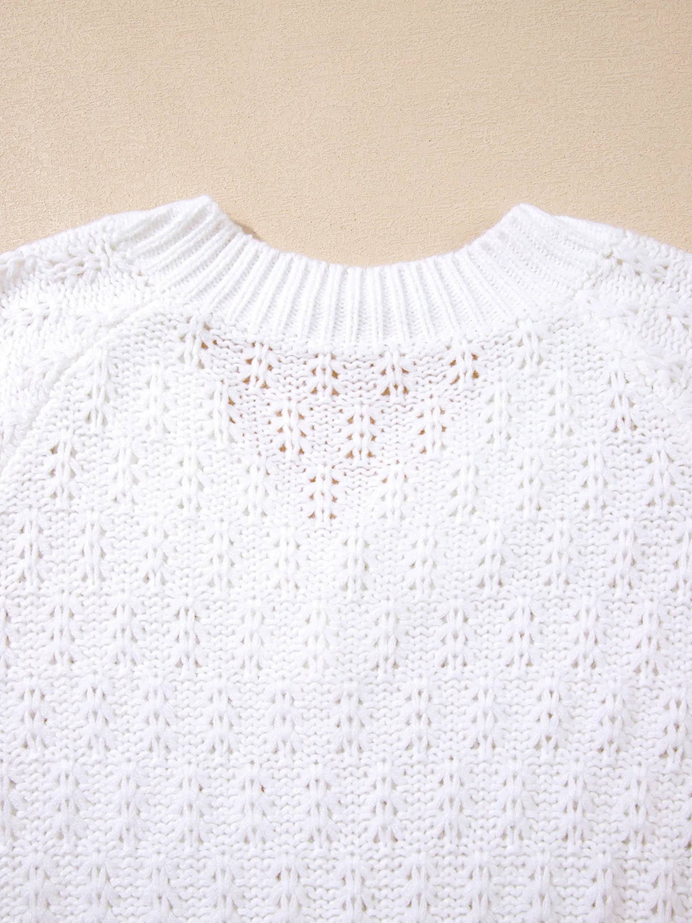 White textured knit V-neck loose sweater with ribbed collar and openwork pattern