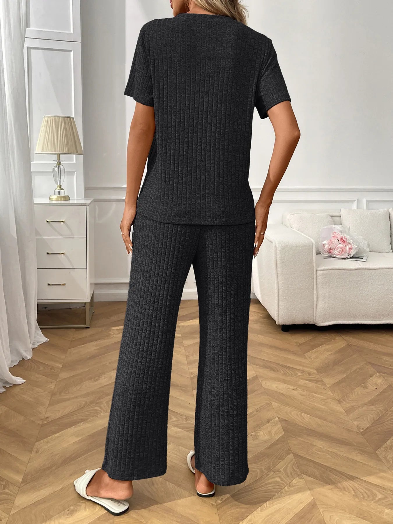 Ribbed knit lounge set with short-sleeve top and wide-leg pants, black, back view
