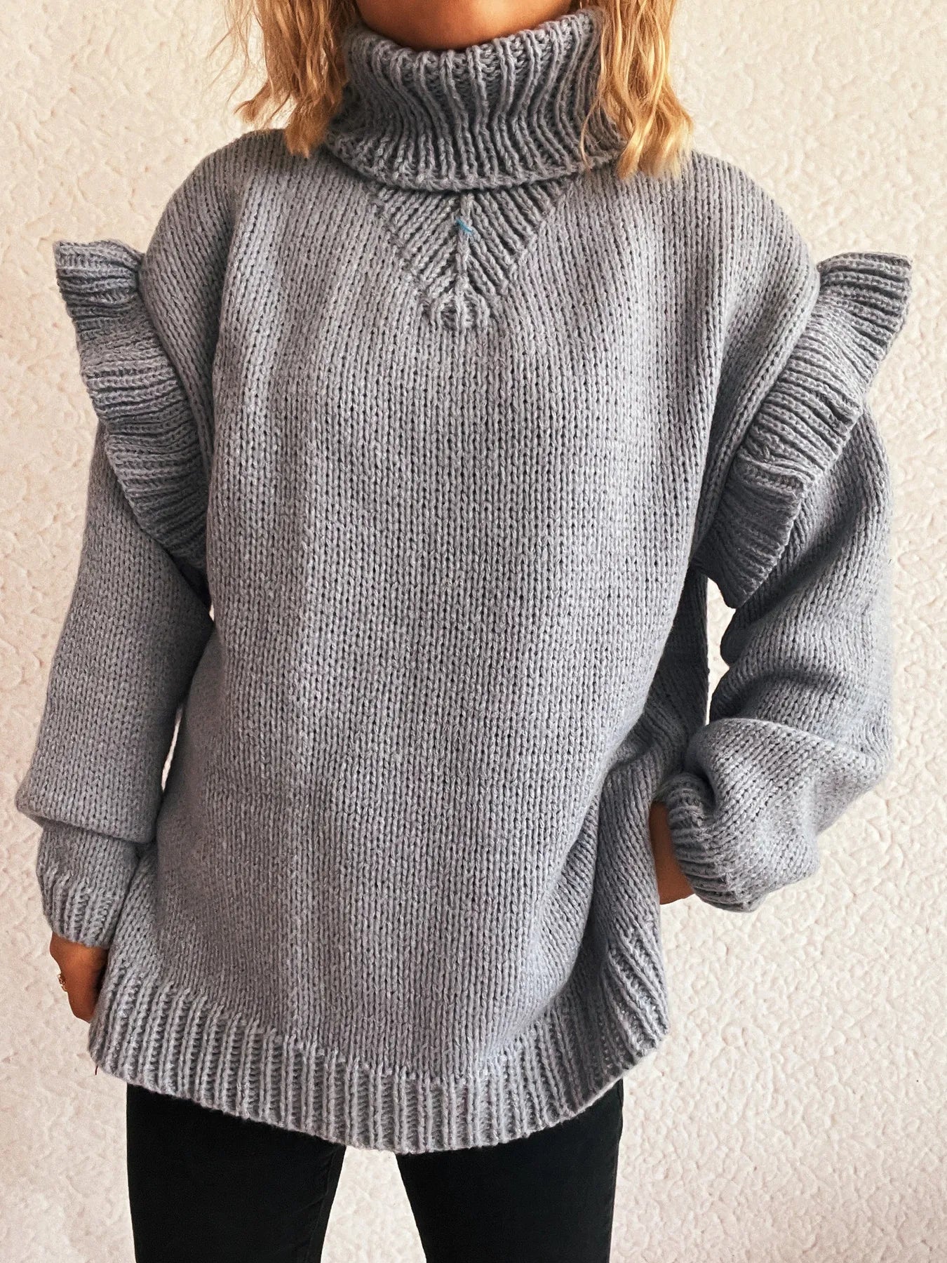 Grey ruffled turtleneck long-sleeve knit sweater with ribbed turtleneck