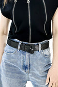 Black glitter vegan leather belt with rectangular buckle on light wash jeans