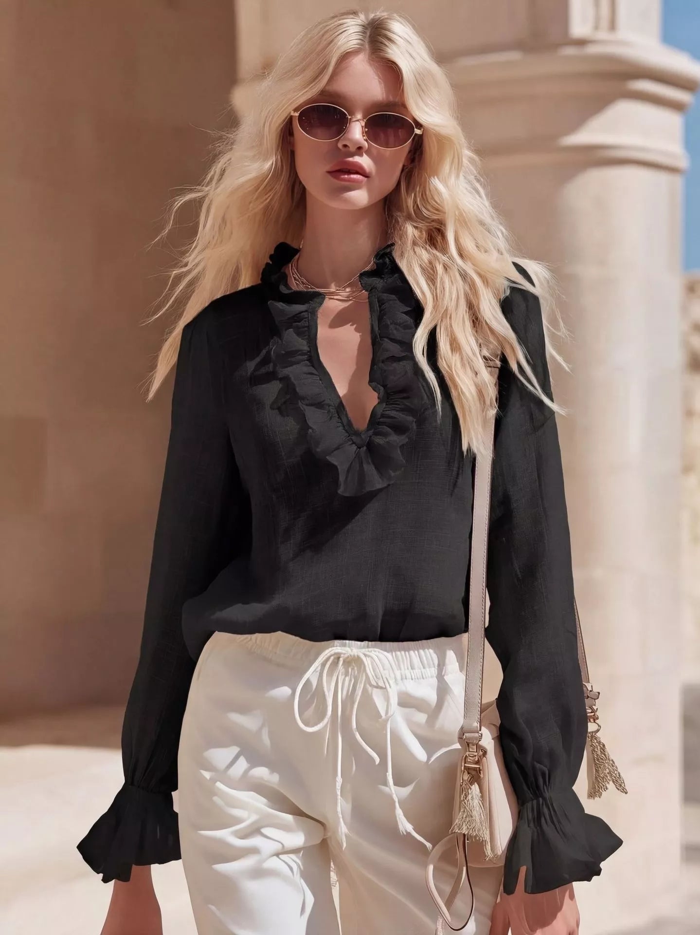 Black ruffled V-neck long-sleeve blouse with frilled neckline