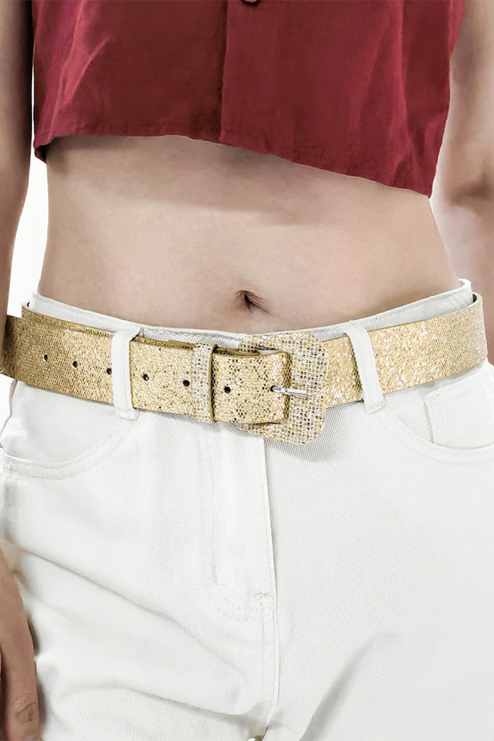 Gold glitter vegan leather belt with square buckle on light denim pants