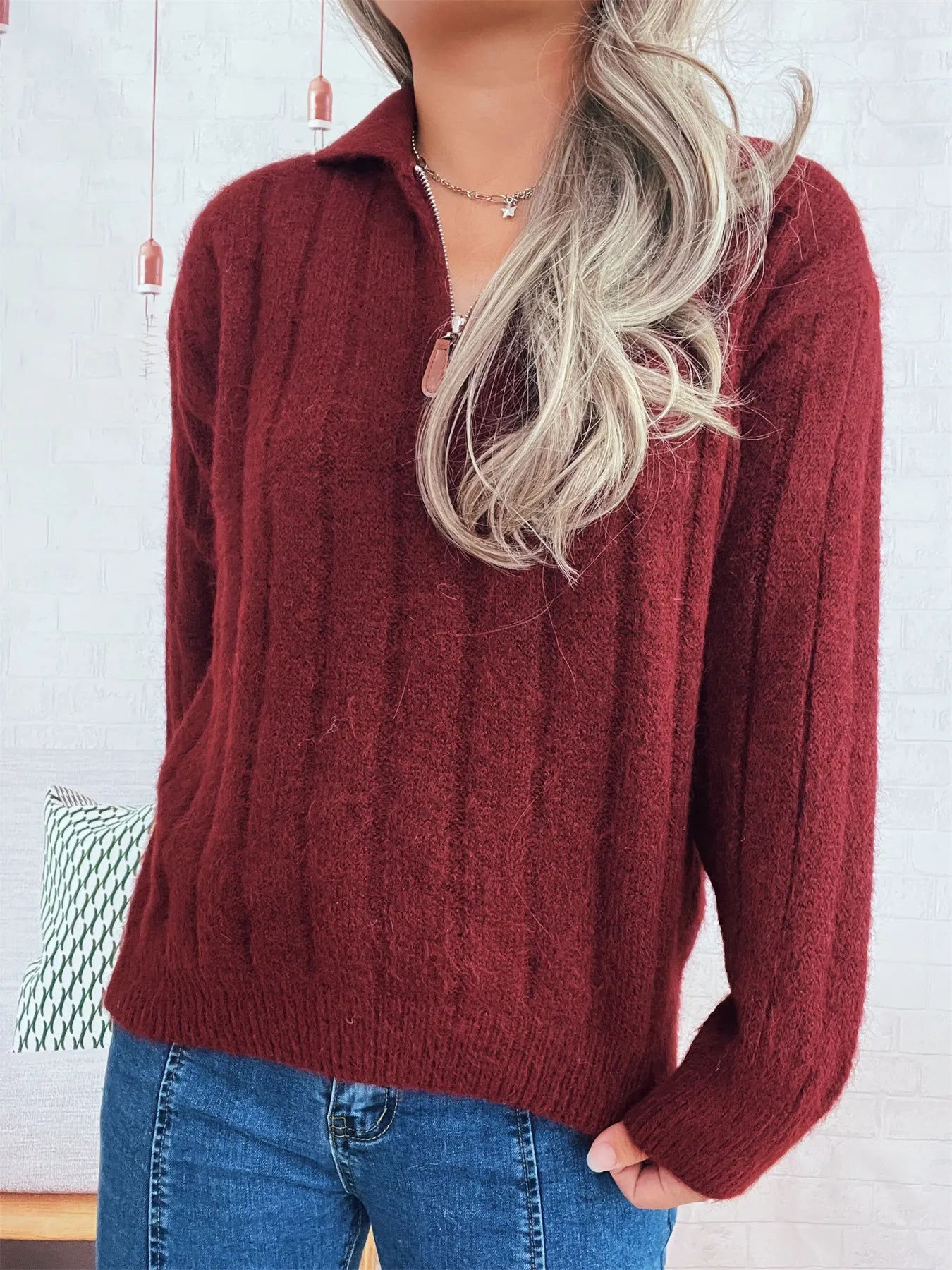 Ribbed hem quarter zip sweater in burgundy, textured knit with quarter-zip collar and long sleeves.
