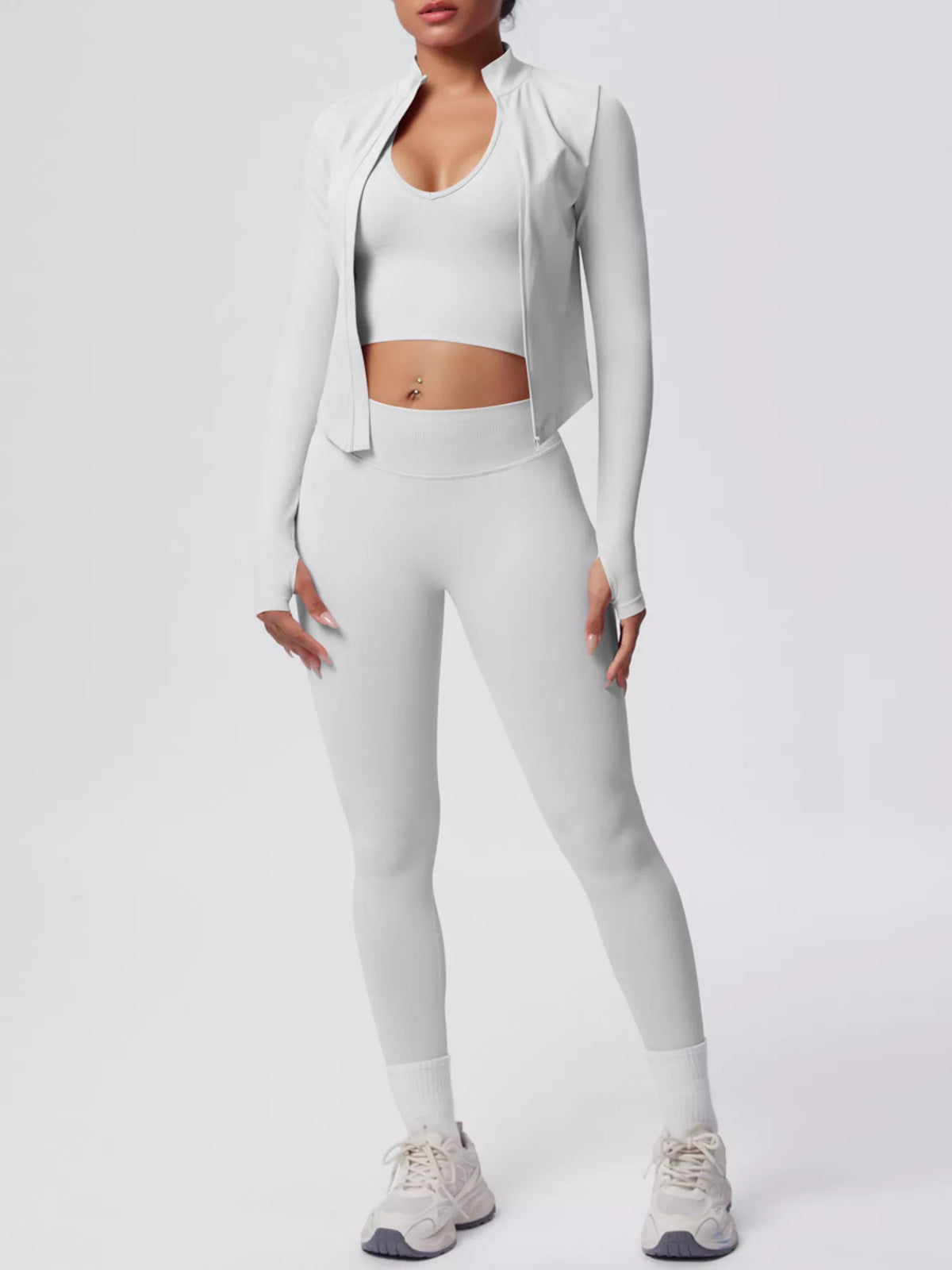 Three-piece workout set in light gray: sports bra, high-waist leggings, open long-sleeve jacket