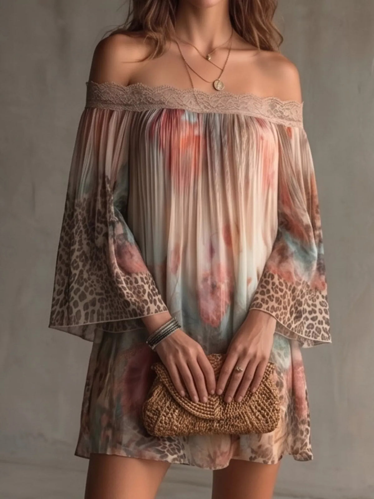 Off-shoulder lace-trim mini dress with multicolor floral leopard print, holding a small bag