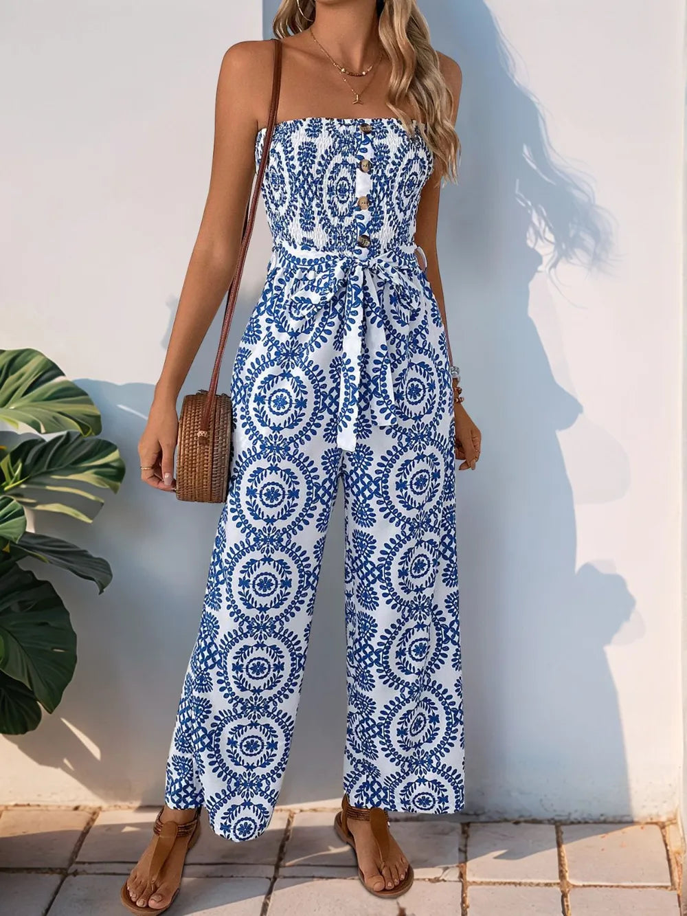 Blue strapless tube wide-leg jumpsuit with navy medallion swirl print and elastic waist