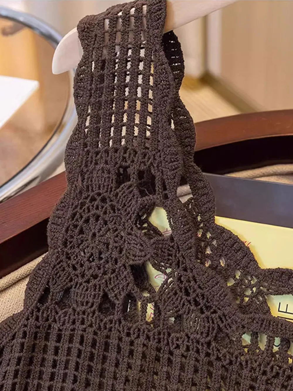 Dark brown openwork scoop-neck tank close-up with thick crochet straps and yoke detail