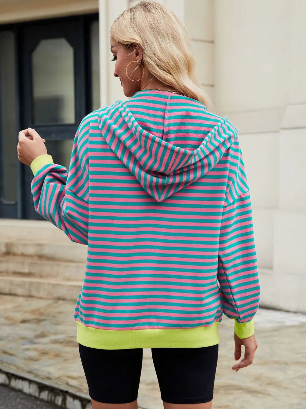 Striped zip-up hoodie with hood and drawstring, back view, teal and pink stripes