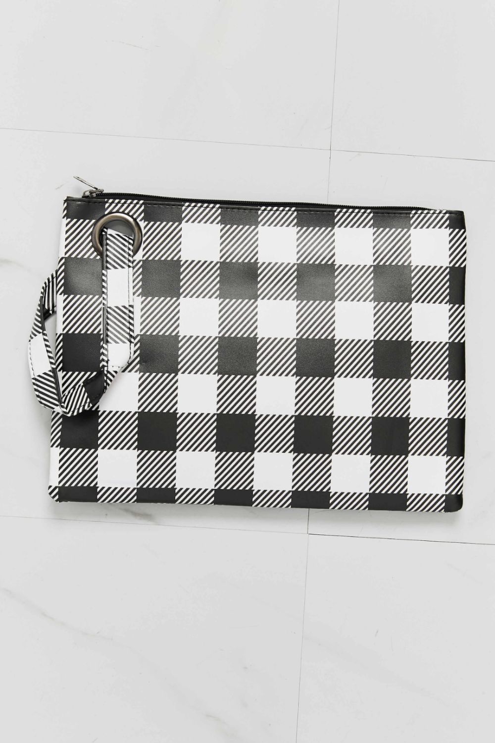 Black and white plaid wristlet pouch with zipper and wrist strap loop