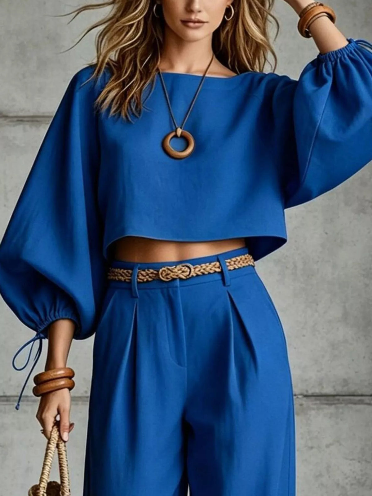 Navy blue balloon-sleeve crop top with embroidered waist belt and wide-leg pants
