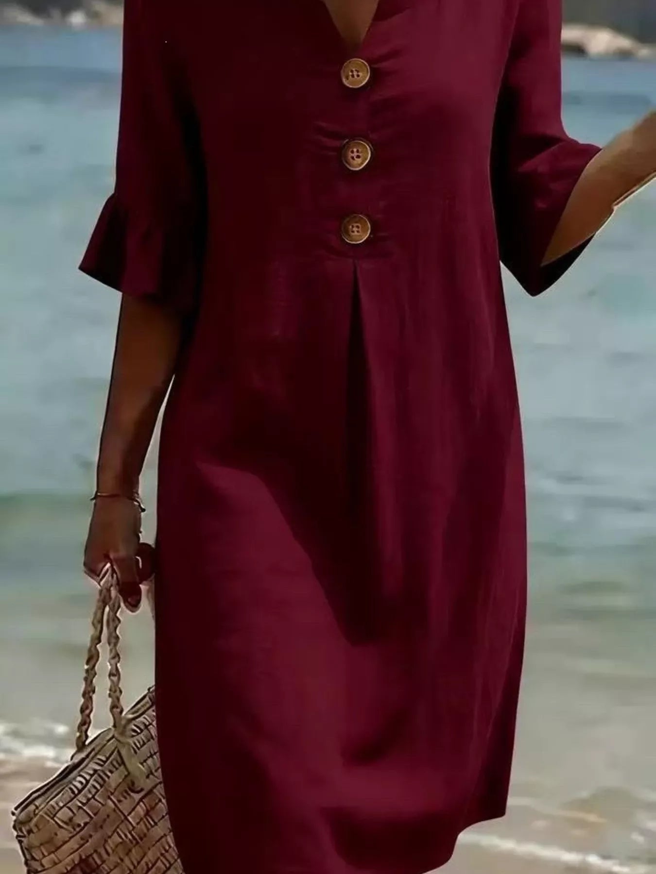Burgundy midi dress with button placket and flared ruffle sleeves