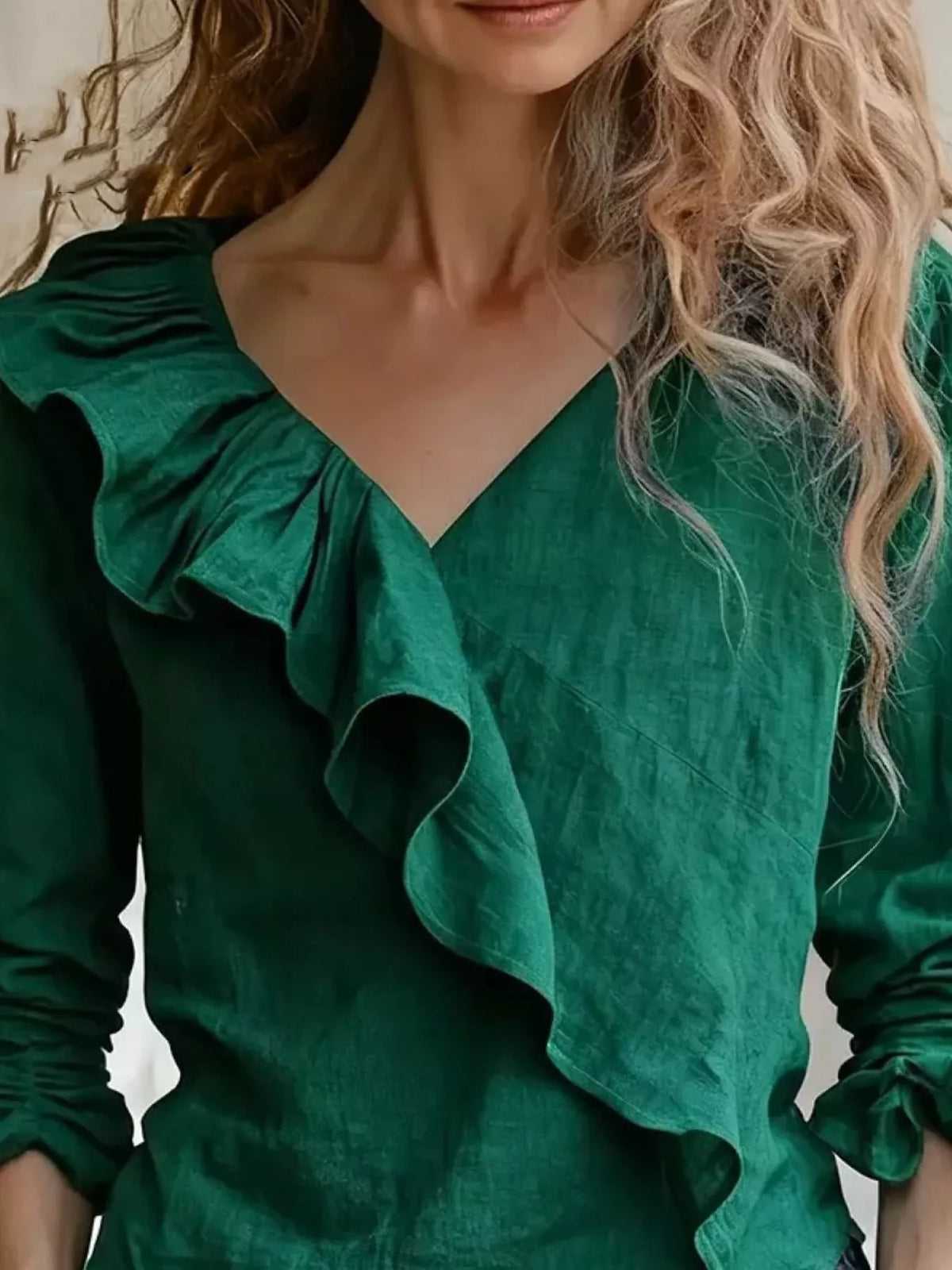 Ruffled V-neck long-sleeve blouse in dark green, with layered ruffle front detail