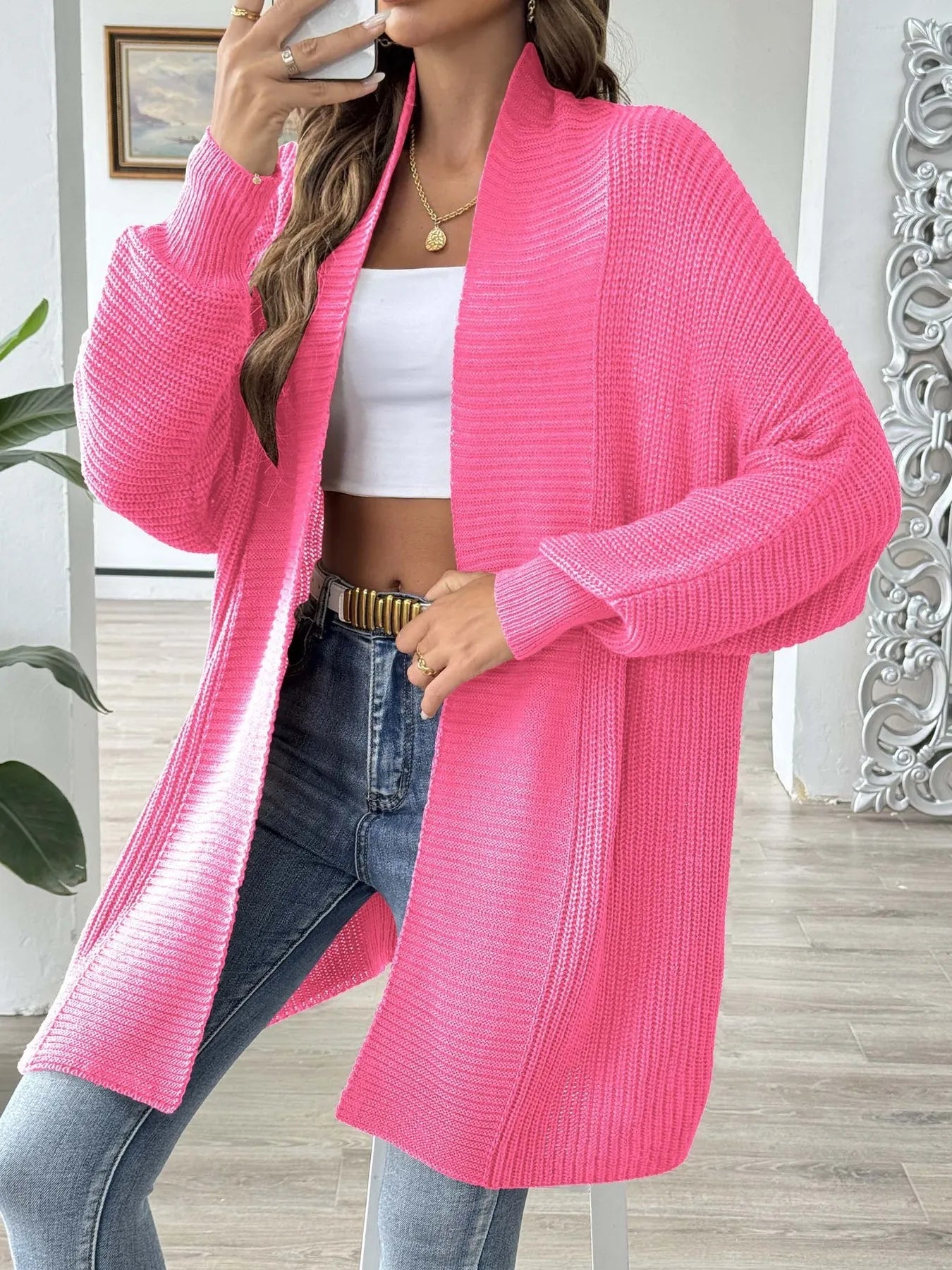 Hot pink knit open-front cardigan with long sleeves, draped long silhouette