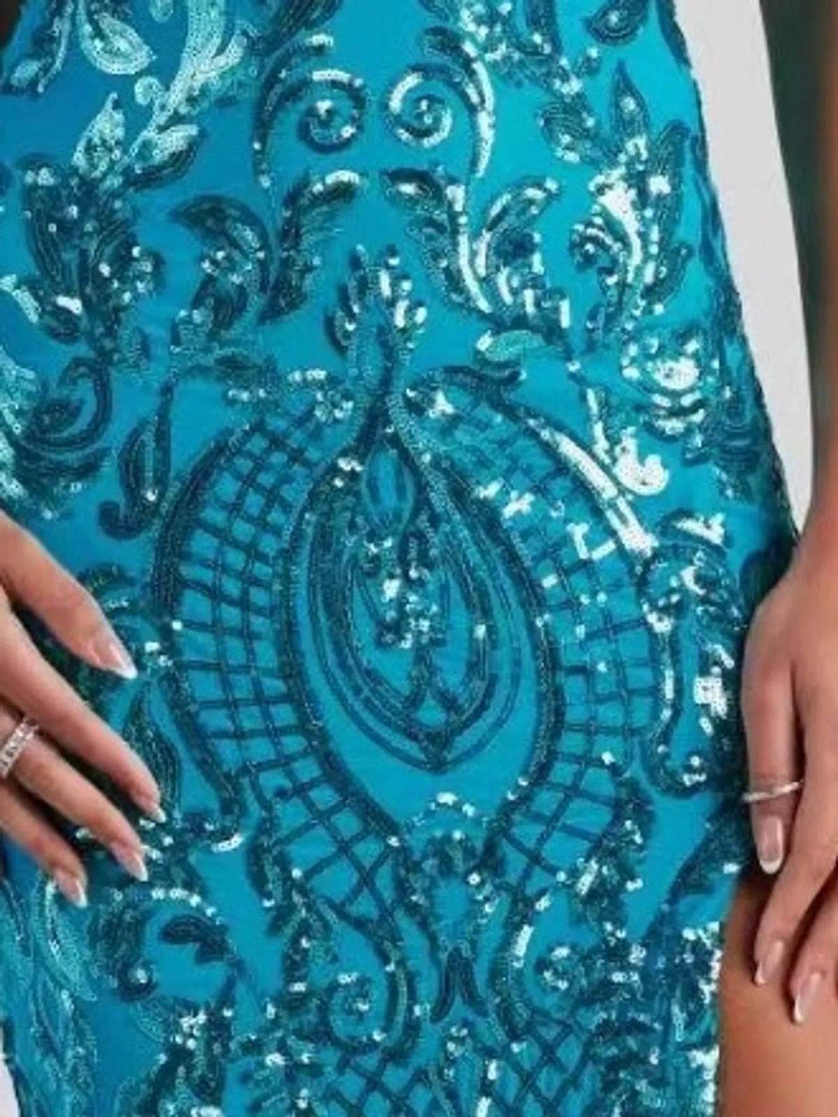 Turquoise sequin evening dress with ornate paisley-style embellishment pattern