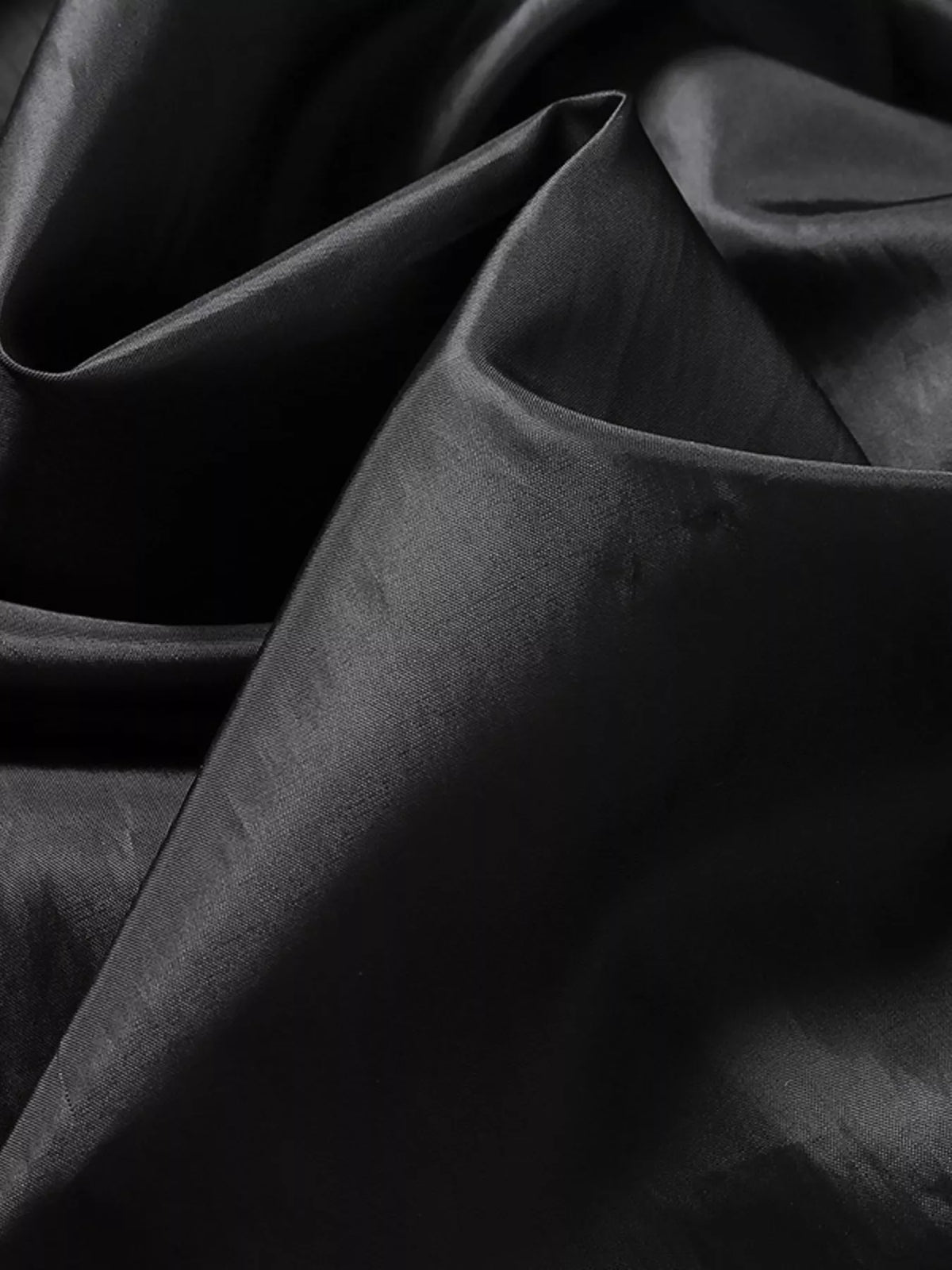 Men’s black vegan leather jacket interior lining fabric fold detail