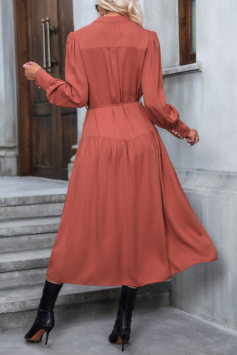 Notched neck button-down dress in rust red, back view, long sleeves, gathered skirt