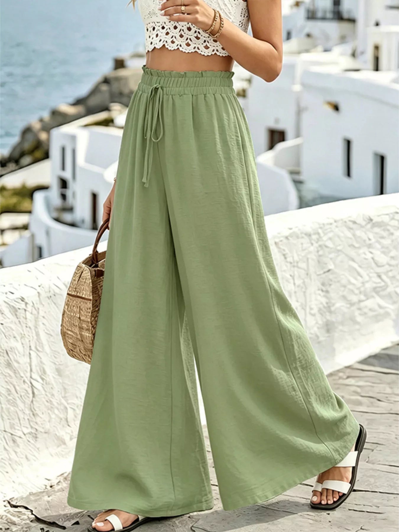 Olive green wide-leg drawstring pants with elastic waistband and relaxed flowy legs