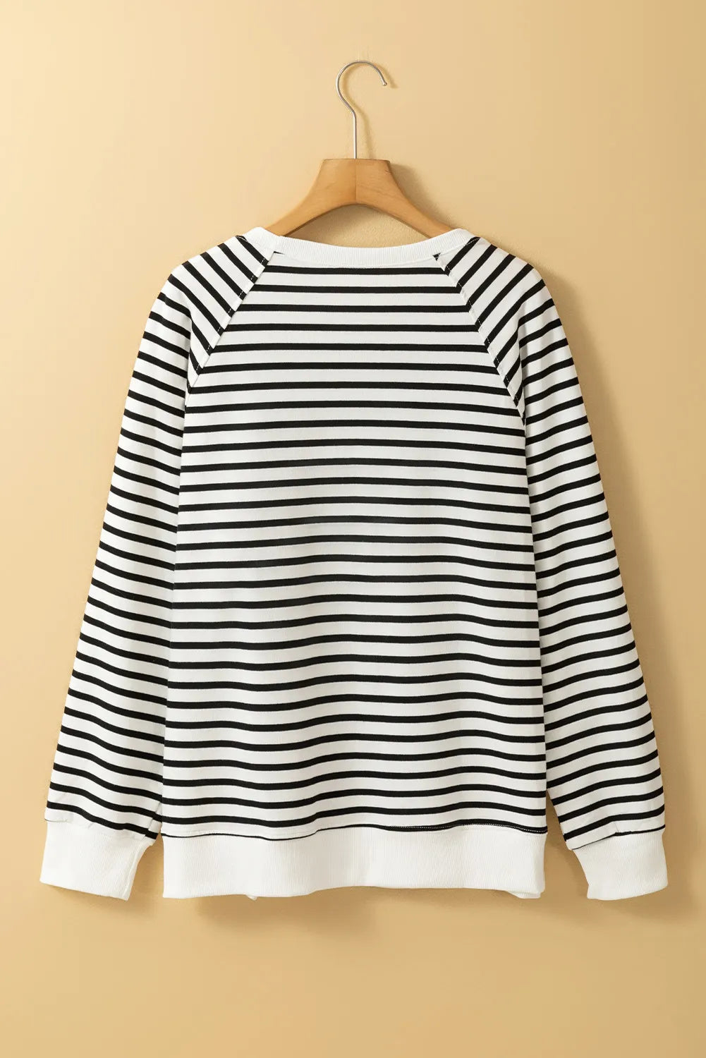 Black-and-cream striped crewneck sweatshirt back view with long sleeves and ribbed cuffs