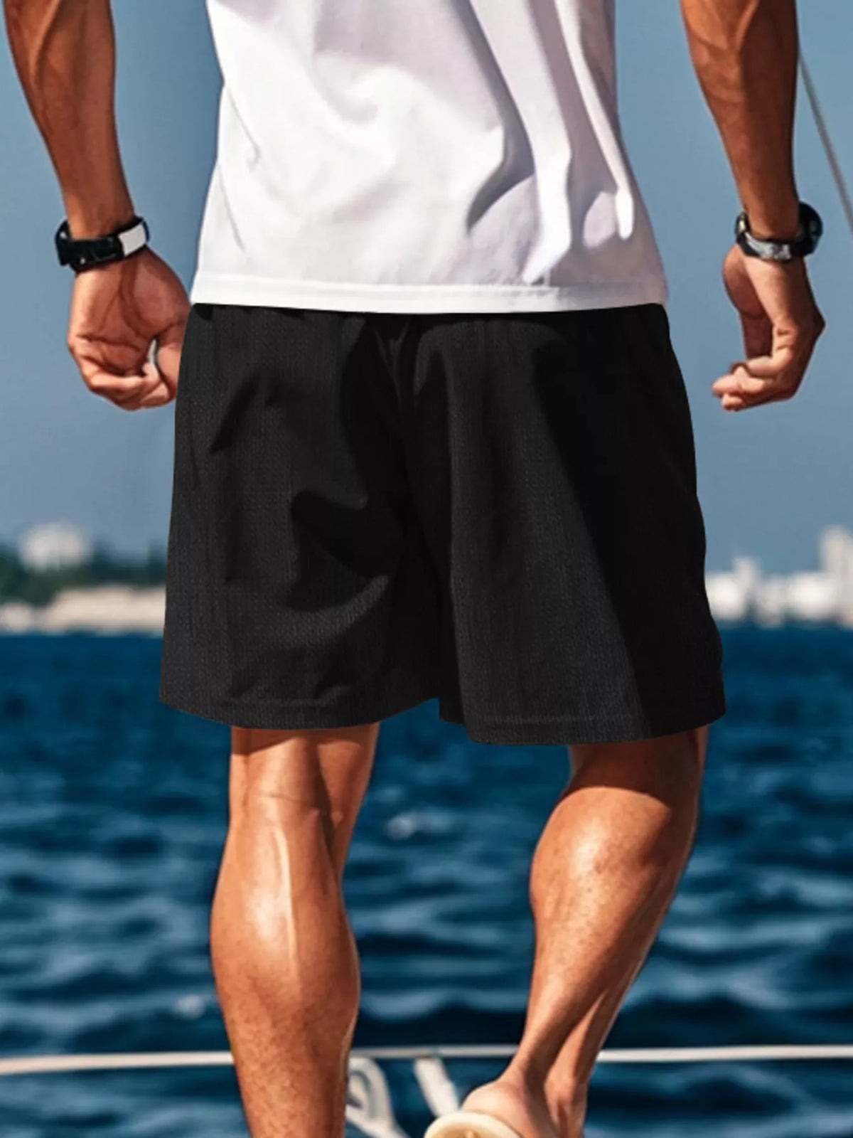 Men's black casual drawstring shorts with side pockets, relaxed fit