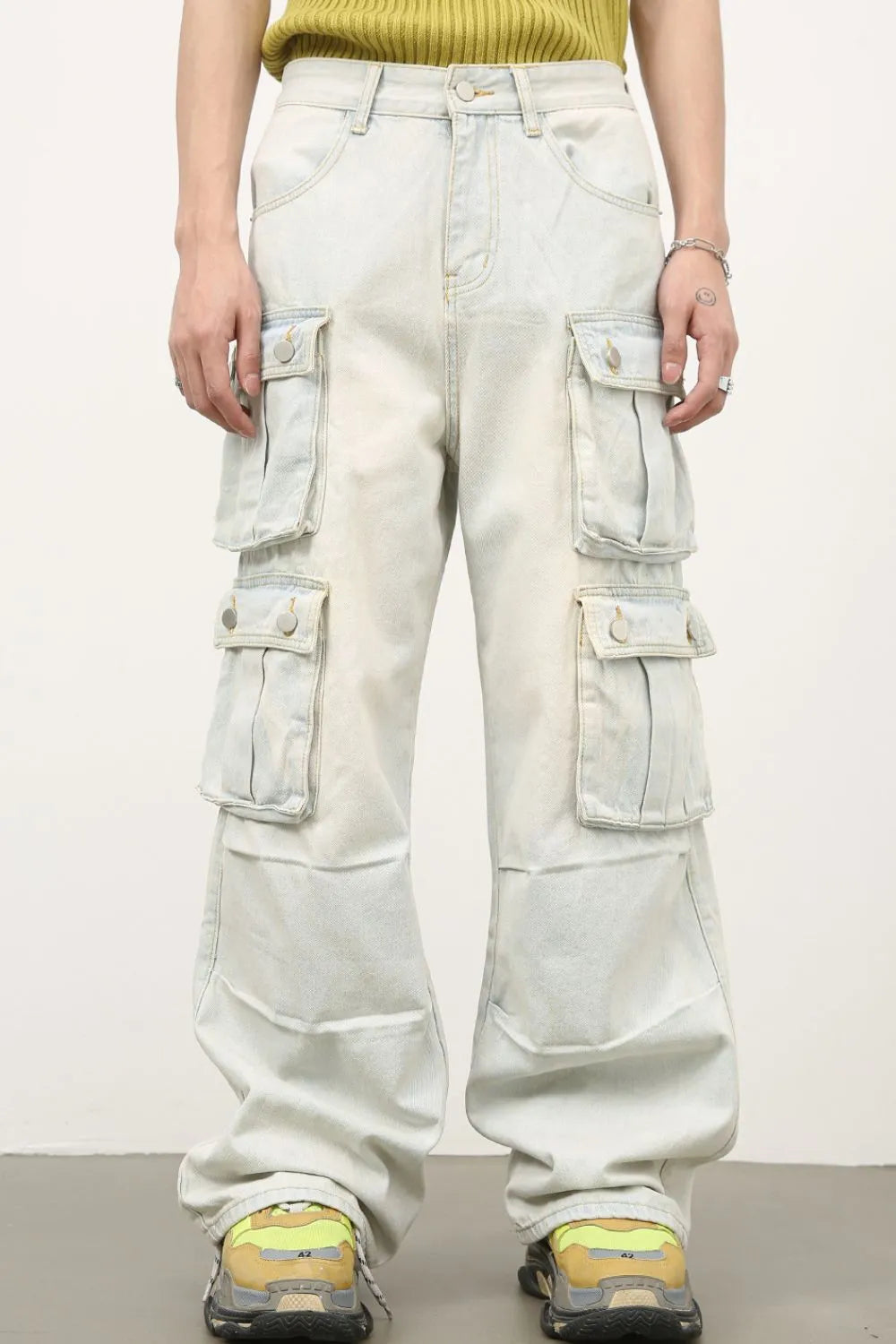 Light-wash mid-rise cargo jeans with four flap cargo pockets, wide straight legs