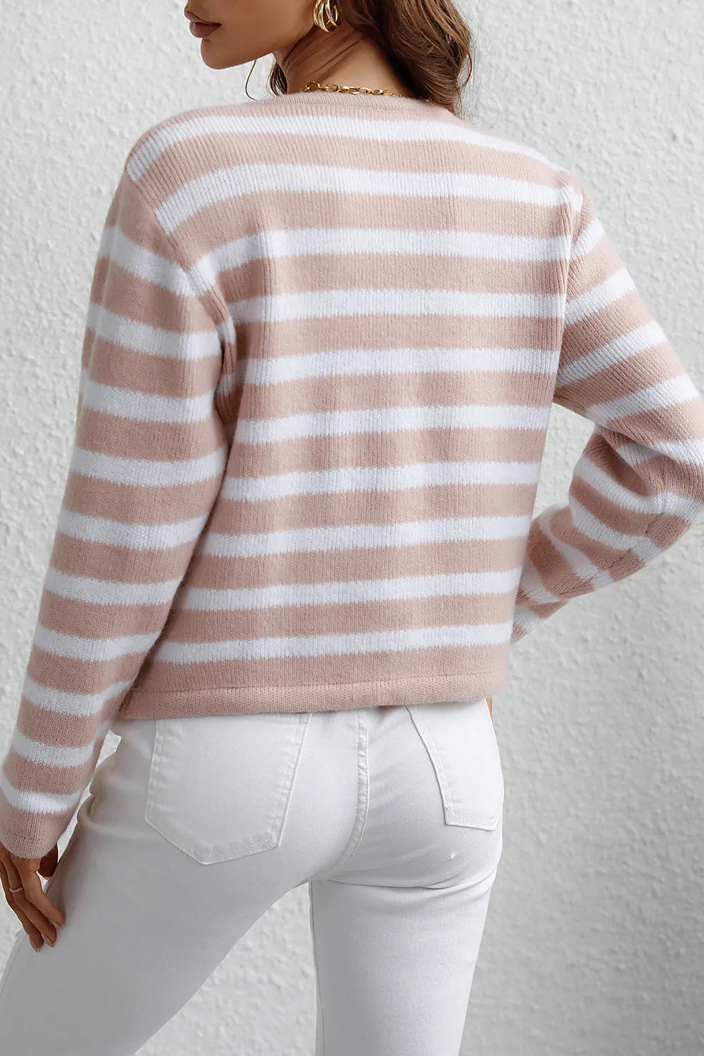 Blush pink and white striped cardigan, back view with long sleeves and button placket