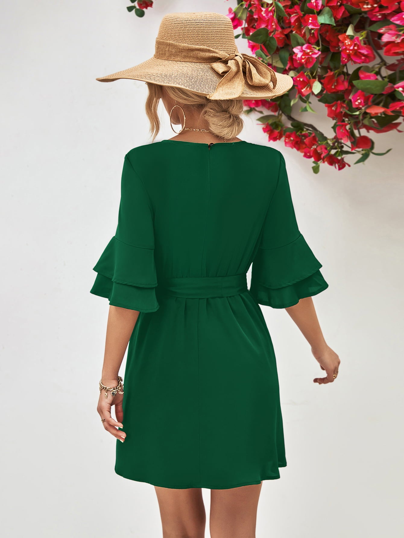 Forest green round-neck dress with tie belt and flounce sleeves, shown from back
