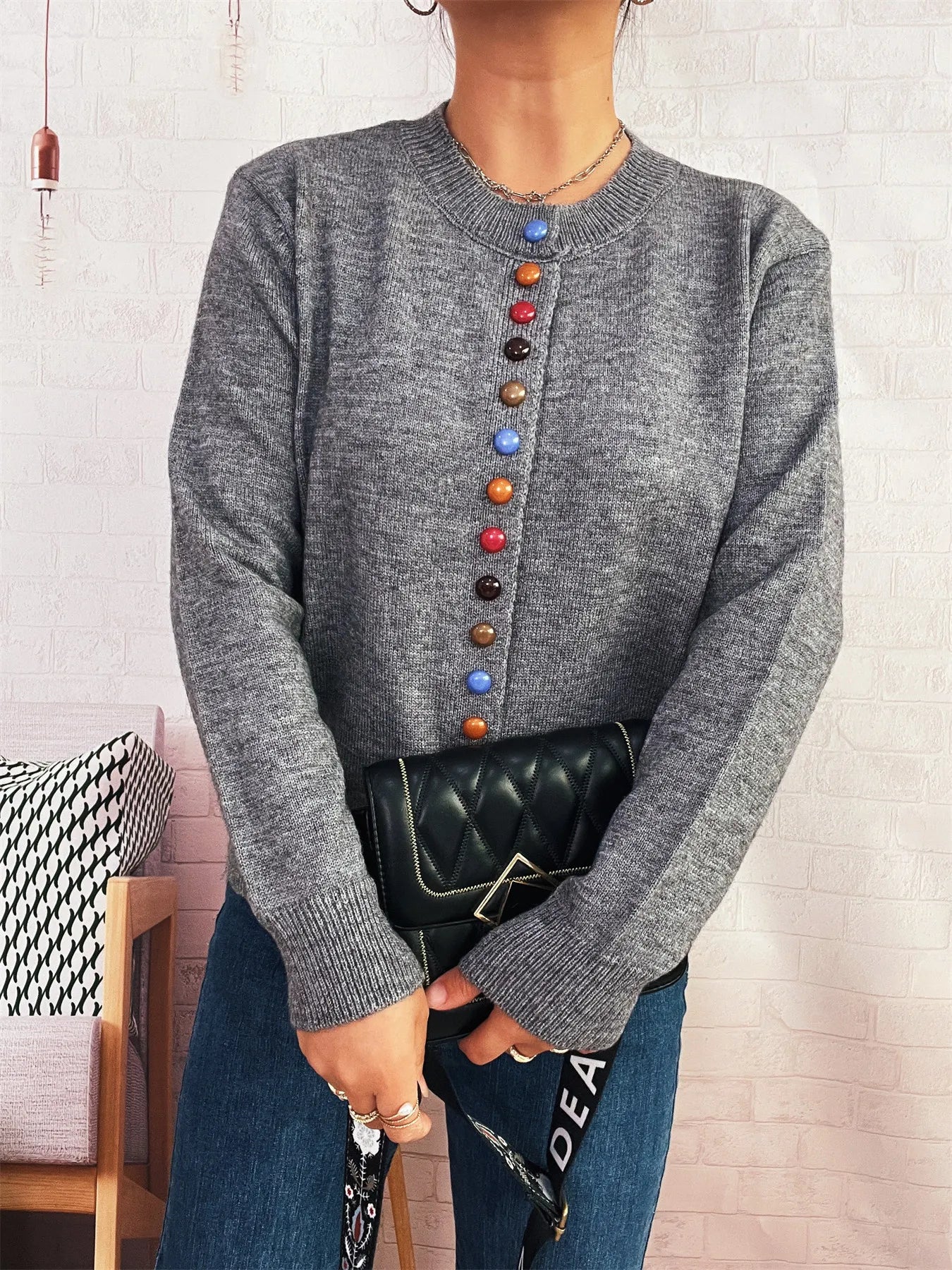 Gray knit button-front cardigan with crew neck and vertical colorful button placket