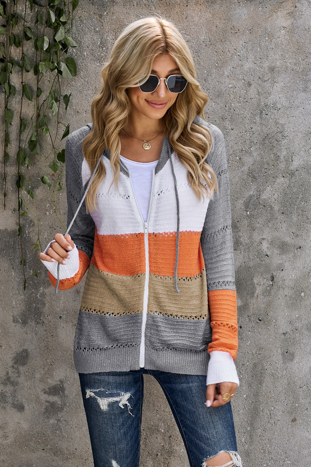 Gray zip-up hooded cardigan with openwork texture, orange and white horizontal stripe panels