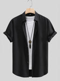 Black short-sleeve button-up shirt with point collar and front buttons