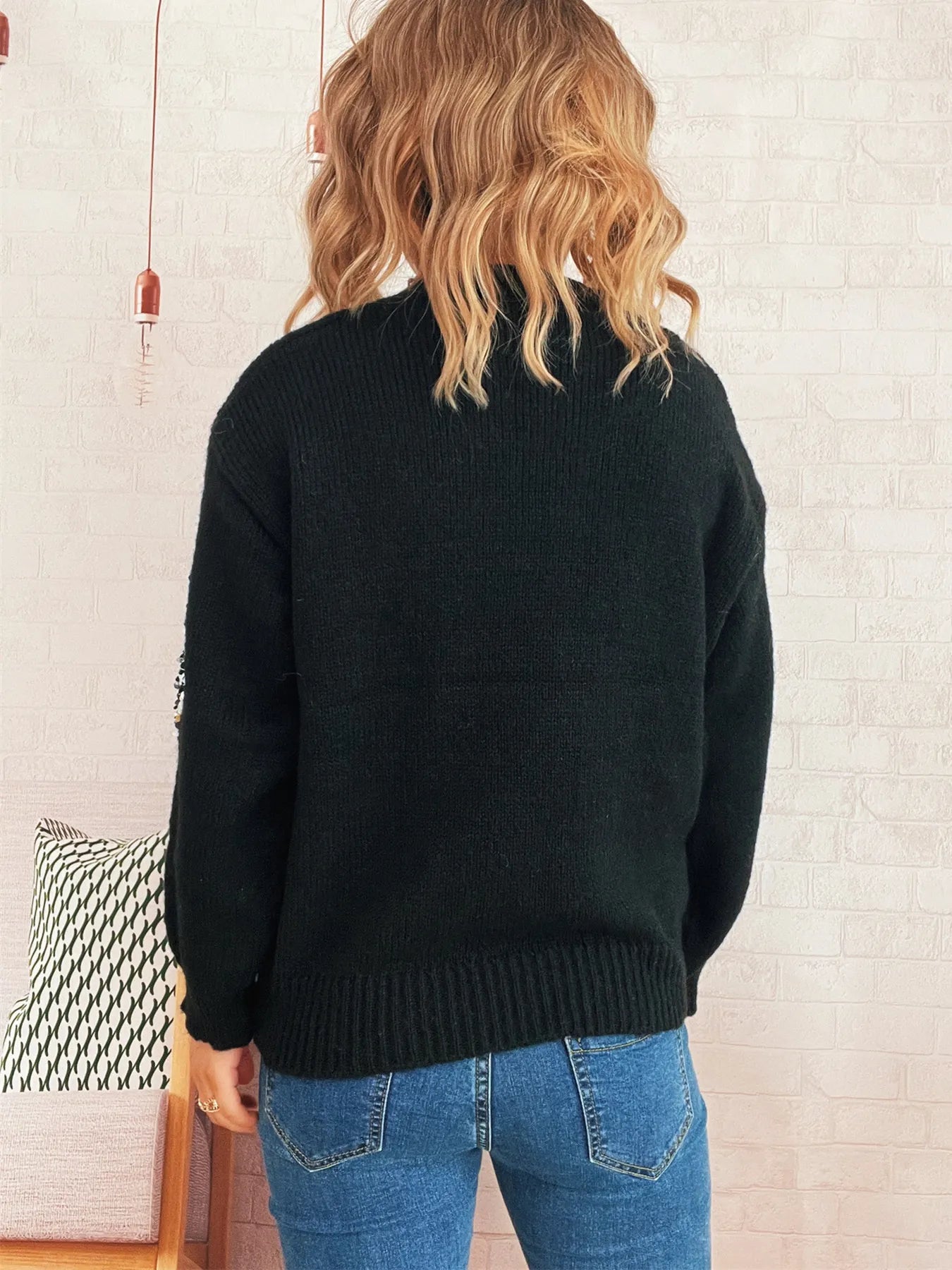 Black oversized sweater, ribbed hem and cuffs, with side sequin sparkle