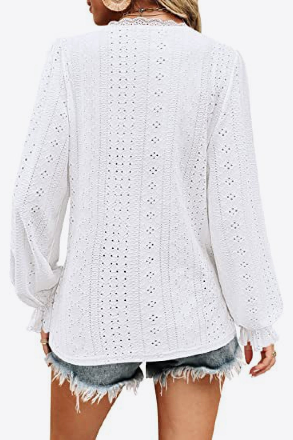 Back view white eyelet V-neck blouse with long puff sleeves and gathered cuffs
